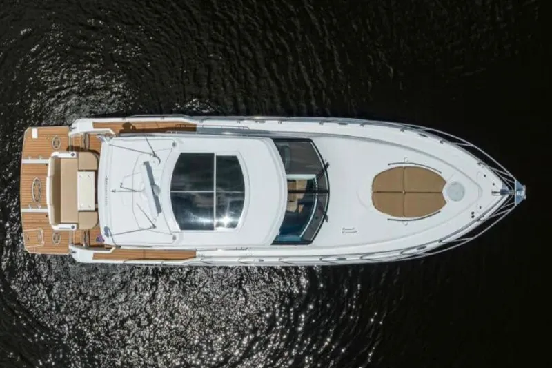  Yacht Photos Pics Aerial view of 2015 Cruisers Cantius yacht on dark water.