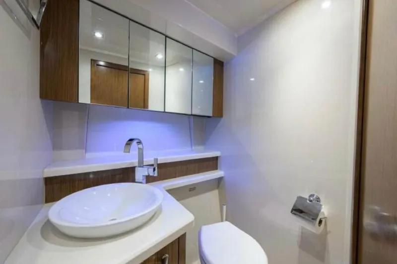  Yacht Photos Pics Luxurious bathroom in 2015 Cruisers Cantius yacht with modern fixtures and elegant design.