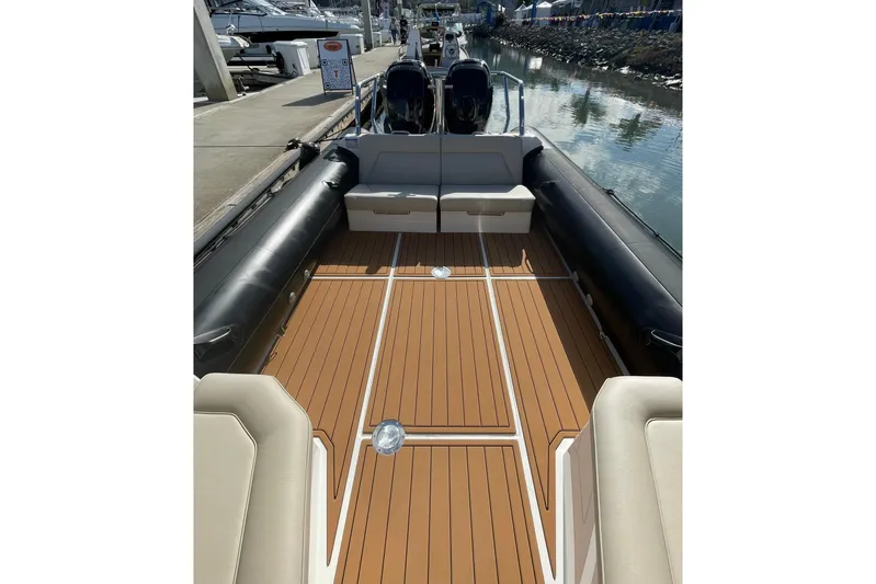  Yacht Photos Pics 2024 Protector 330 Targa boat interior with teak flooring and twin 400 HP engines.