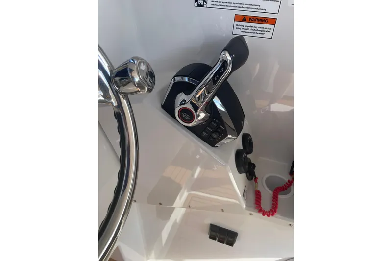  Yacht Photos Pics Close-up of 2024 Protector 330 Targa boat controls and steering wheel.
