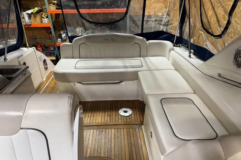  Yacht Photos Pics 2011 Sea Ray 310 Sundancer interior with white seating and wood flooring.