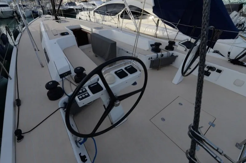  Yacht Photos Pics 2019 Solaris 50 yacht deck with steering wheel and control panels.