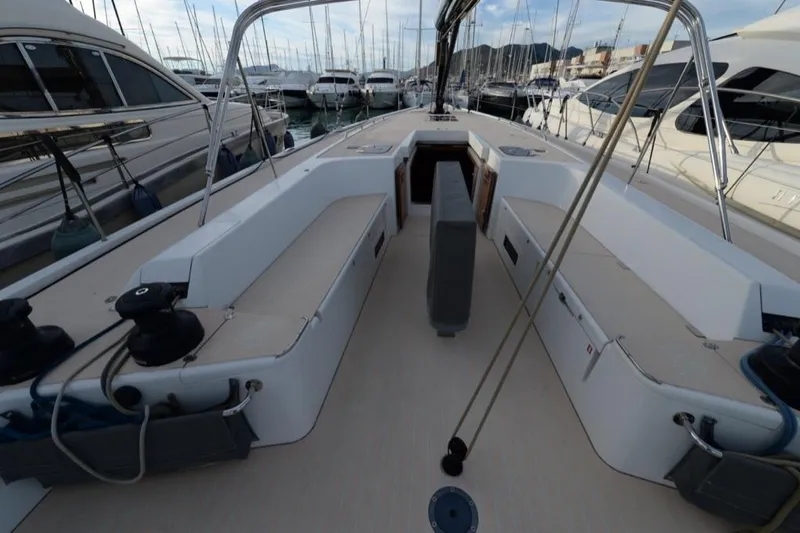  Yacht Photos Pics 2019 Solaris 50 yacht cockpit with seating, docked among other boats.