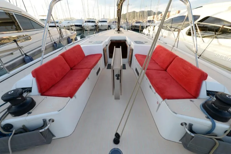  Yacht Photos Pics Luxurious 2019 Solaris 50 yacht deck with red cushioned seating in marina.