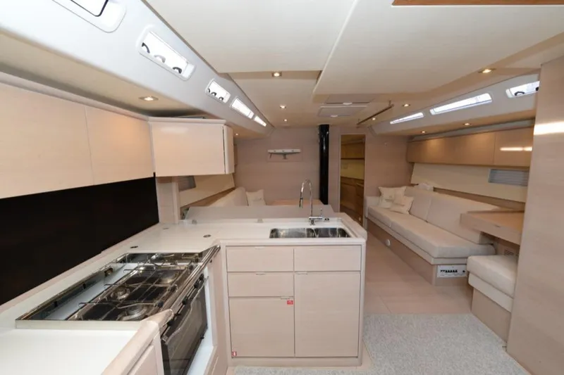  Yacht Photos Pics Luxurious interior of 2019 Solaris 50 yacht with modern kitchen and seating area.