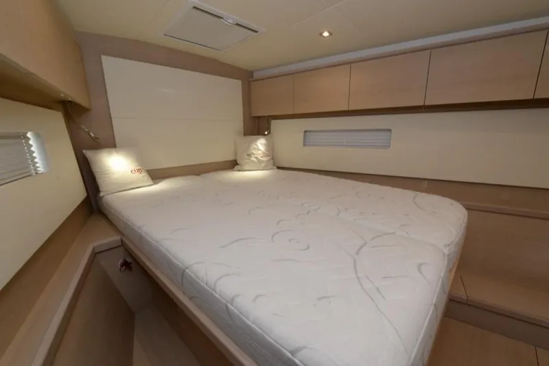  Yacht Photos Pics Luxurious interior cabin of 2019 Solaris 50 yacht with comfortable bed and modern design.