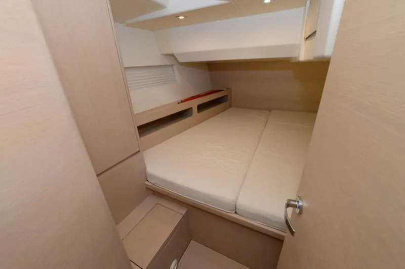  Yacht Photos Pics Cozy cabin interior of 2019 Solaris 50 yacht with minimalist design and soft lighting.