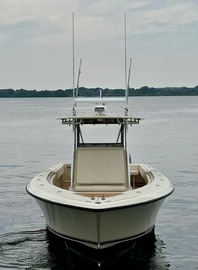 Wild Life Yacht Photos Pics 2010 Contender 39 Tournament boat on calm water, front view.