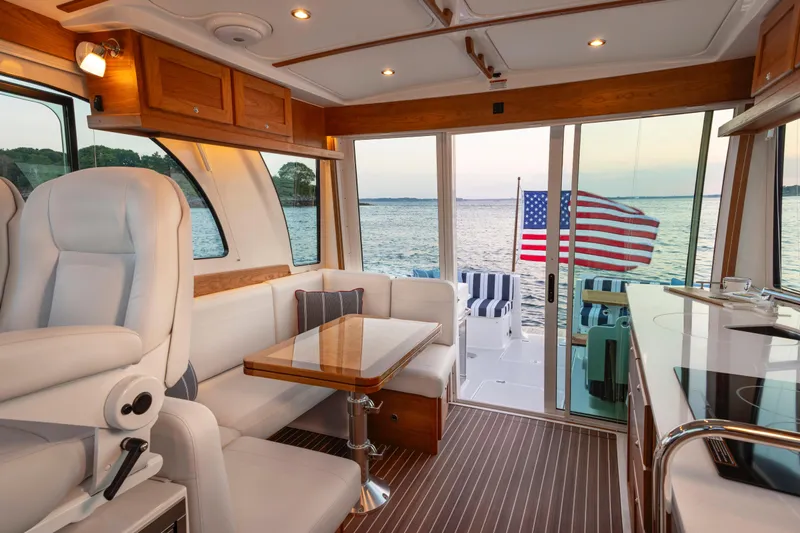 Ready For Customization Yacht Photos Pics Luxurious interior of 2027 Back Cove 412 yacht with American flag and ocean view.