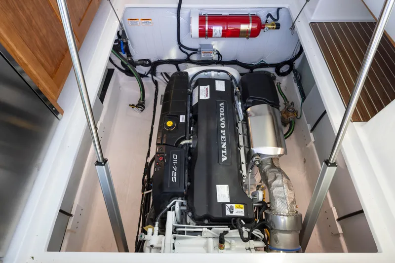 Ready For Customization Yacht Photos Pics Engine compartment of 2027 Back Cove 412 with Volvo Penta engine and fire extinguisher.