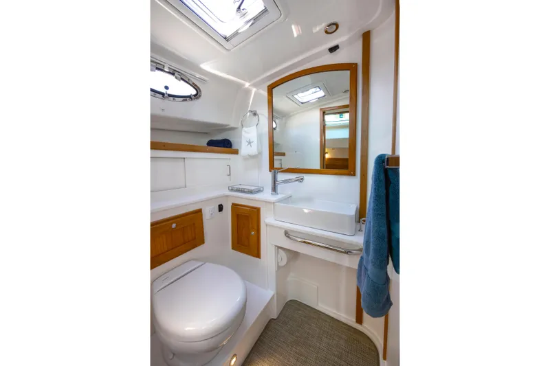 Ready For Customization Yacht Photos Pics Luxurious bathroom in 2027 Back Cove 412 yacht, featuring modern fixtures and elegant wood accents.