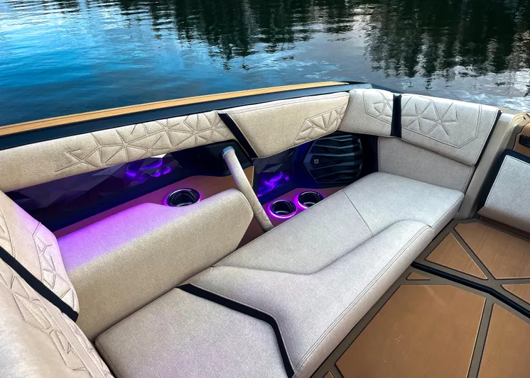 Yacht Photos Pics Luxurious interior of 2026 Nautique Paragon G25 boat with ambient lighting.