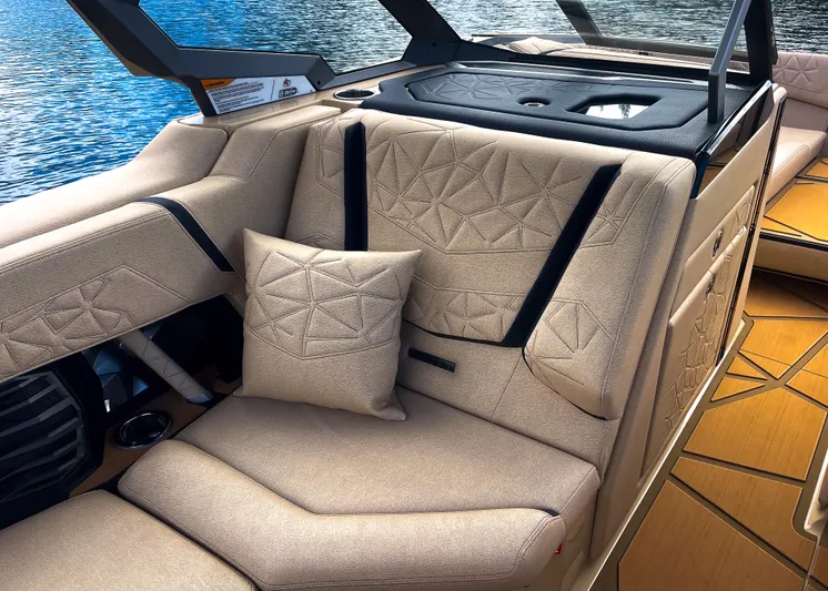  Yacht Photos Pics Luxurious interior of 2026 Nautique Paragon G25 boat with beige seating and geometric patterns.
