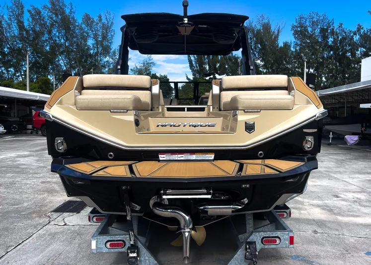  Yacht Photos Pics 2026 Nautique Paragon G25 boat on trailer, rear view, beige and black design.