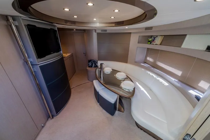  Yacht Photos Pics Luxurious interior of 2015 Riva Rivale 52 yacht with elegant dining area and modern design.