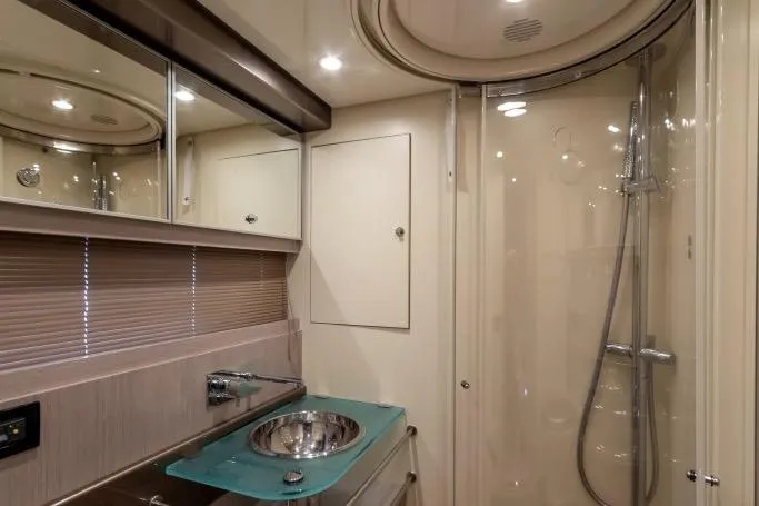 Yacht Photos Pics Luxurious bathroom interior of 2015 Riva Rivale 52 yacht with modern fixtures and shower.