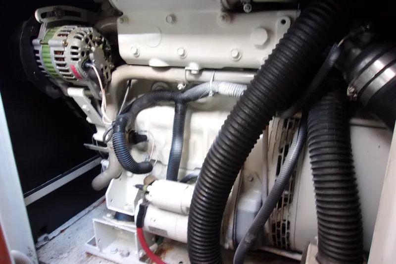  Yacht Photos Pics Engine compartment of a 2015 Riva Rivale 52 yacht, featuring various hoses and components.