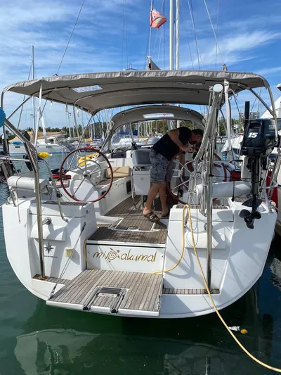 Mi Akumal Yacht Photos Pics Jeanneau Sun Odyssey 40.3 sailboat, 2011 model, docked at marina with people onboard.