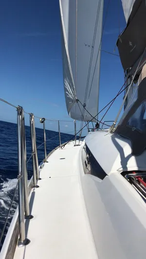 Mi Akumal Yacht Photos Pics Sailing on a 2011 Jeanneau Sun Odyssey 40.3 yacht under clear blue skies.