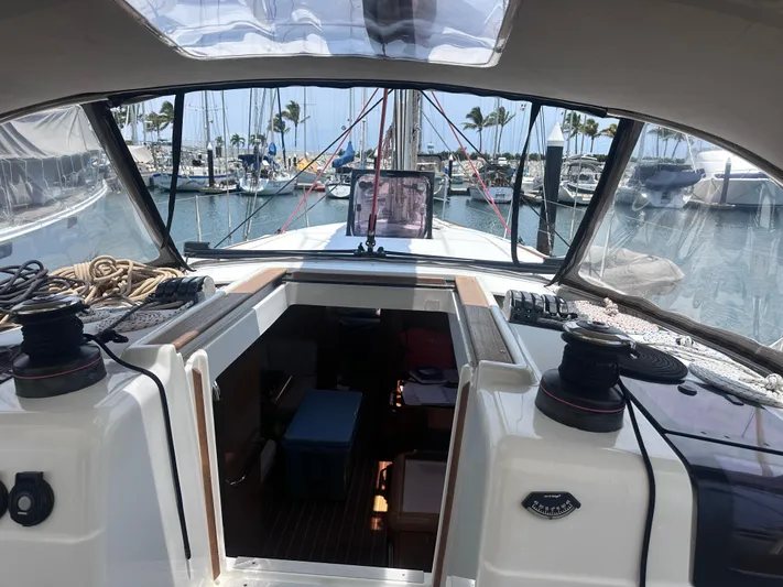 Mi Akumal Yacht Photos Pics Jeanneau Sun Odyssey 40.3 sailboat cockpit view, marina background, 2011 model.