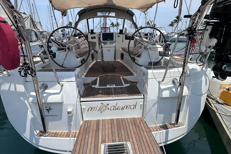 Mi Akumal Yacht Photos Pics Jeanneau Sun Odyssey 40.3 sailboat, 2011 model, docked with dual steering wheels and teak deck.