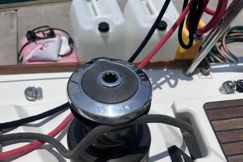 Mi Akumal Yacht Photos Pics Winch on Jeanneau Sun Odyssey 40.3 sailboat deck, 2011 model, with ropes and containers.