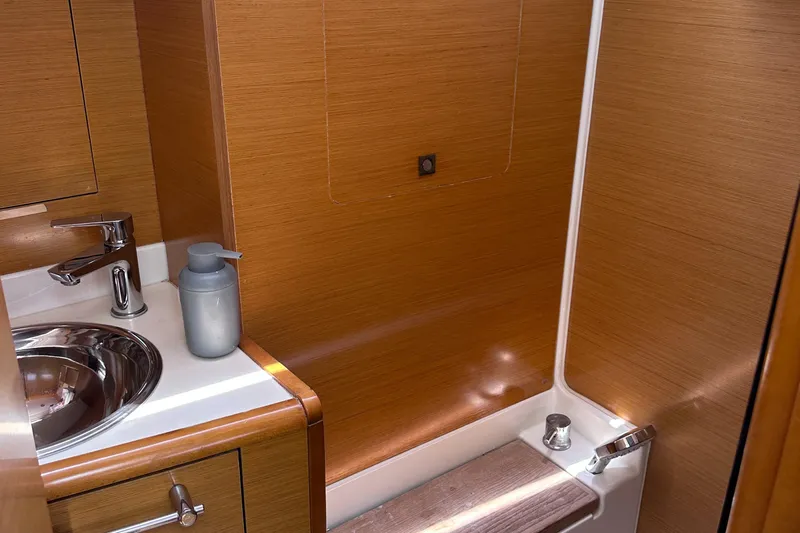 Mi Akumal Yacht Photos Pics Jeanneau Sun Odyssey 40.3 bathroom interior, featuring wooden finish and modern fixtures, 2011 model.