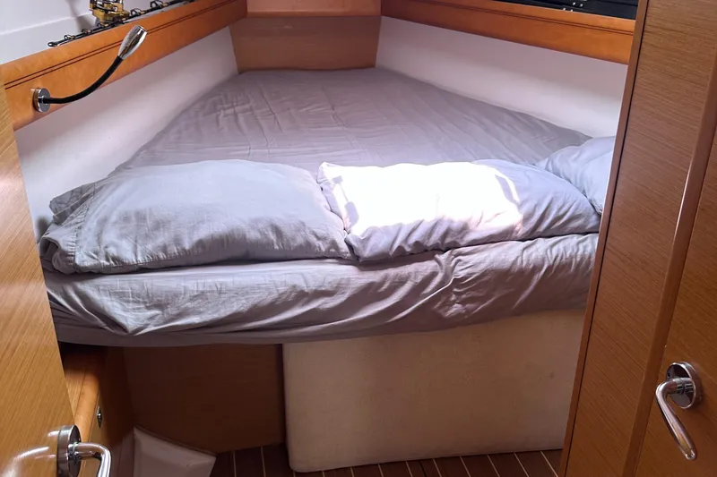 Mi Akumal Yacht Photos Pics Cozy cabin interior of 2011 Jeanneau Sun Odyssey 40.3 with comfortable bedding.