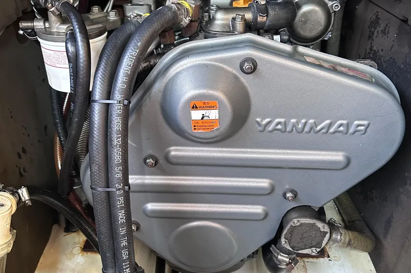 Mi Akumal Yacht Photos Pics Yanmar engine in a 2011 Jeanneau Sun Odyssey 40.3 sailboat, showcasing detailed components.