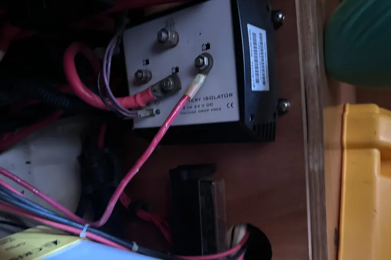 Mi Akumal Yacht Photos Pics Battery isolator and wiring inside a 2011 Jeanneau Sun Odyssey 40.3 sailboat.