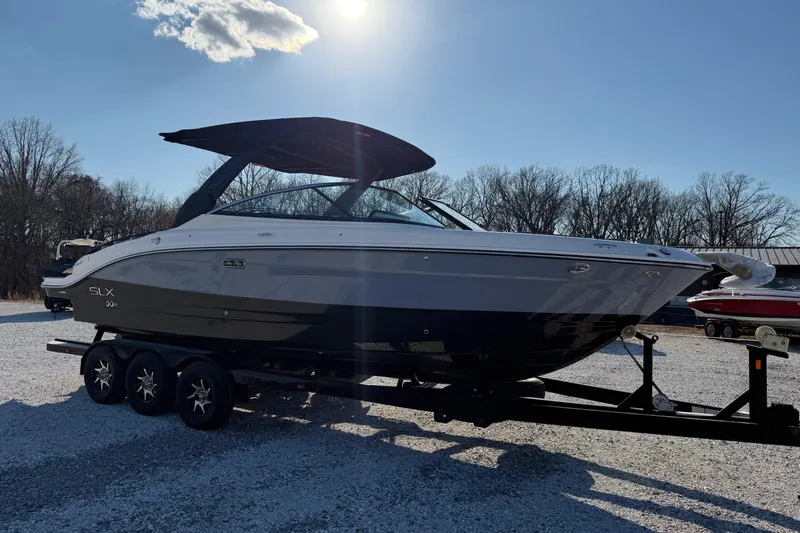  Yacht Photos Pics 2026 Sea Ray SLX 280 boat on trailer under clear sky.