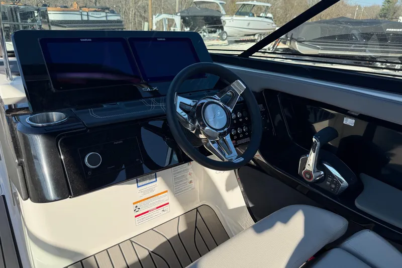  Yacht Photos Pics 2026 Sea Ray SLX 280 boat dashboard with steering wheel and control panel.
