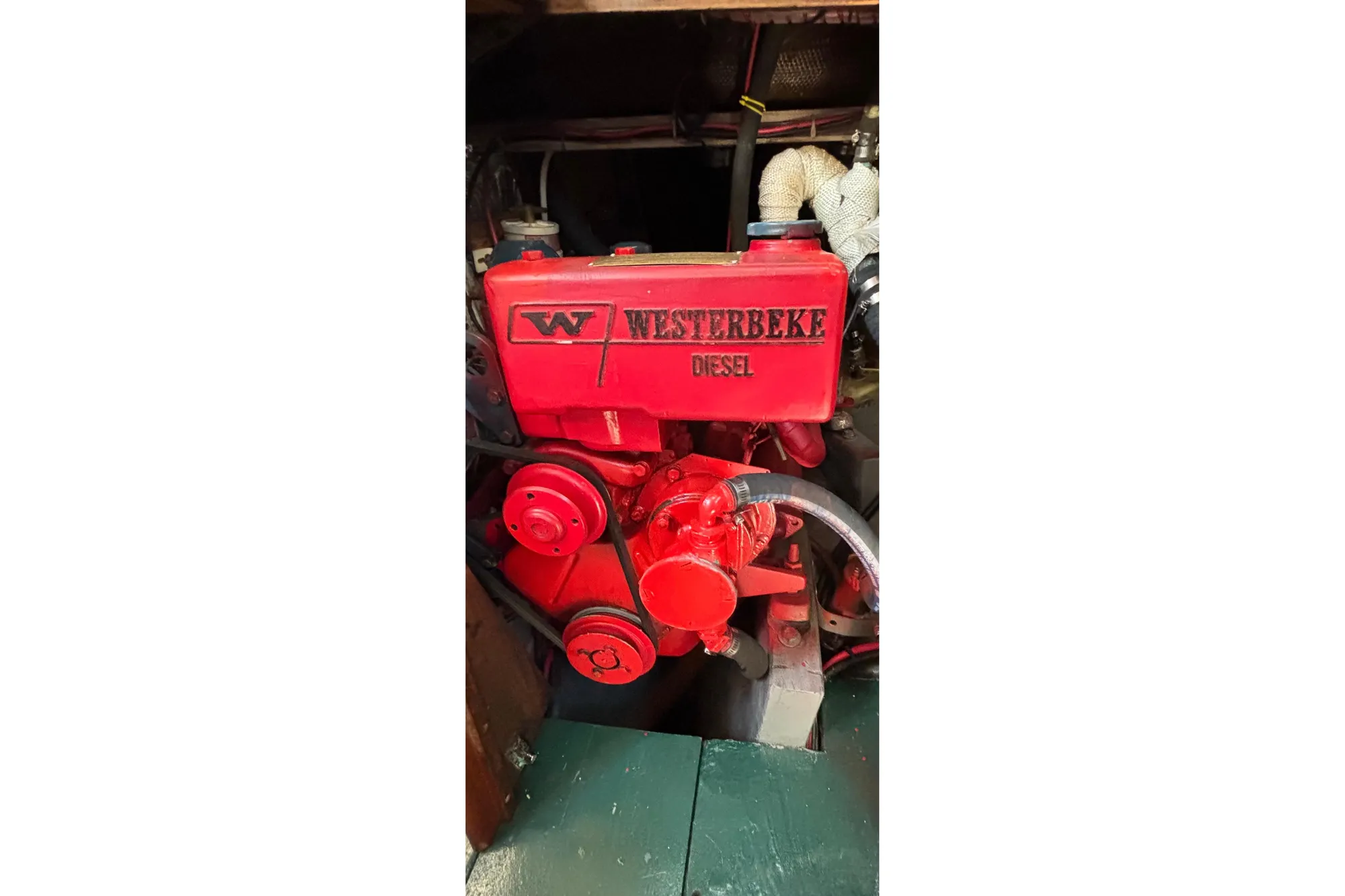 Red Westerbeke diesel engine in a 1968 Spencer 35 boat.