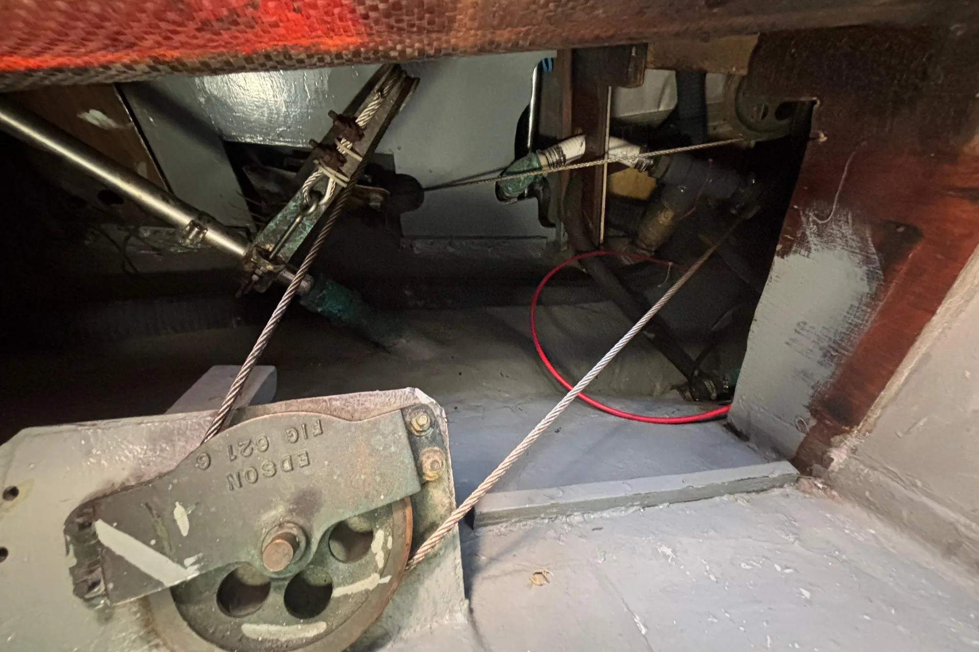 Interior mechanical components of a 1968 Spencer 35 boat, featuring cables and pulleys.