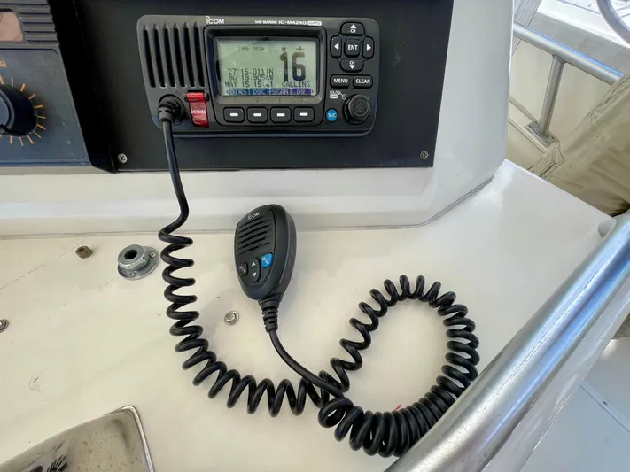 Islander 7 Yacht Photos Pics VHF radio on 1988 Bertram 43 Convertible boat dashboard with coiled microphone.