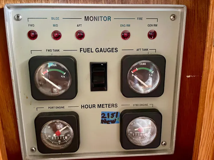 Islander 7 Yacht Photos Pics 1988 Bertram 43 Convertible fuel and hour meter panel with gauges and indicators.