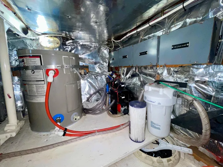 Islander 7 Yacht Photos Pics Engine room of a 1988 Bertram 43 Convertible with water filtration system and equipment.