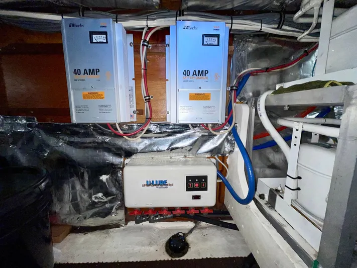 Islander 7 Yacht Photos Pics Electrical system in a 1988 Bertram 43 Convertible boat engine room.