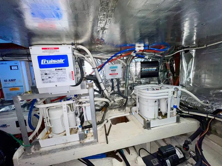 Islander 7 Yacht Photos Pics Engine room of 1988 Bertram 43 Convertible with Cruisair systems and wiring.