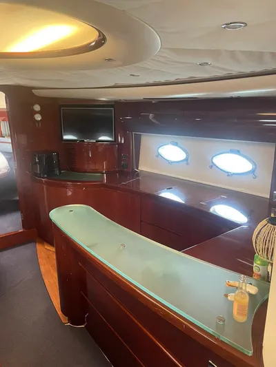Princess V65 | 65ft | 2004 Yacht Photos Pics Luxurious interior of a 2004 Princess V65 yacht with modern amenities and elegant wood finishes.