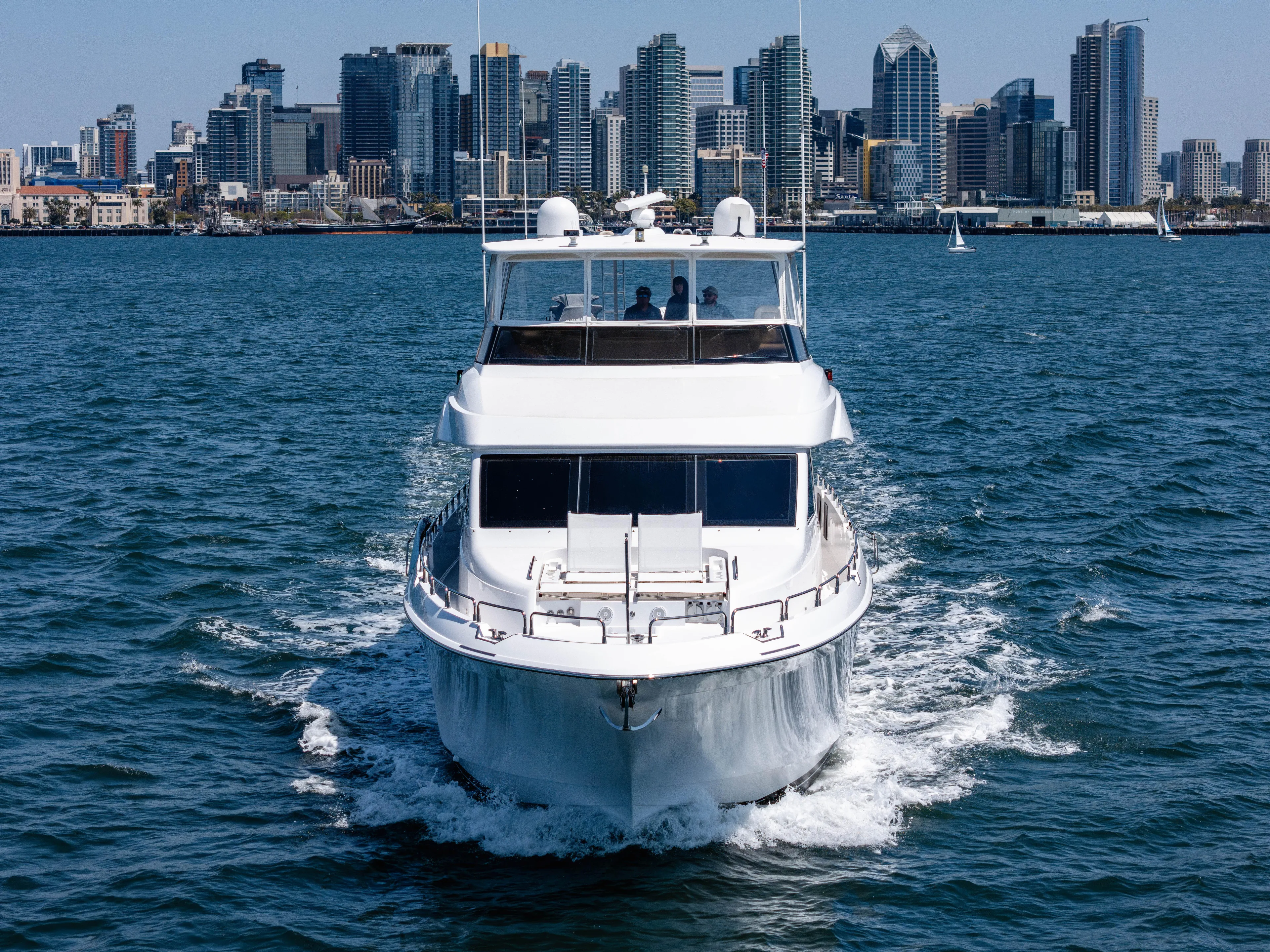 Miss Sealaneous Expense II Yacht Photos Pics 2008 Hatteras 72 Motor Yacht cruising with city skyline in background.