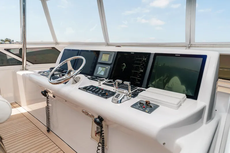 Miss Sealaneous Expense II Yacht Photos Pics Helm station of 2008 Hatteras 72 Motor Yacht with modern navigation equipment.