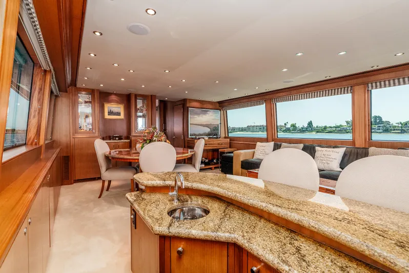 Miss Sealaneous Expense II Yacht Photos Pics Luxurious interior of 2008 Hatteras 72 Motor Yacht with elegant wood and granite finishes.