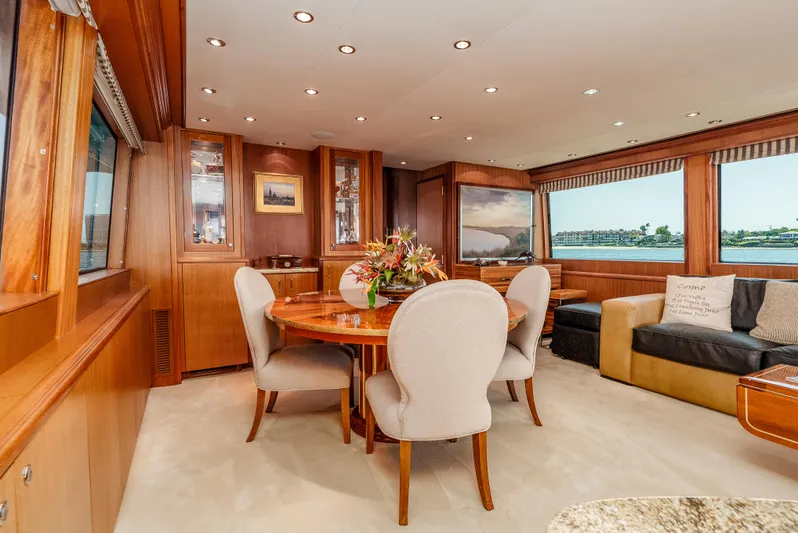 Miss Sealaneous Expense II Yacht Photos Pics Luxurious interior of 2008 Hatteras 72 Motor Yacht with elegant dining area and plush seating.