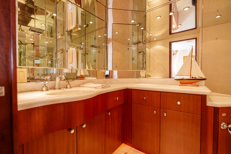 Miss Sealaneous Expense II Yacht Photos Pics Luxurious bathroom in 2008 Hatteras 72 Motor Yacht with elegant wood cabinetry.