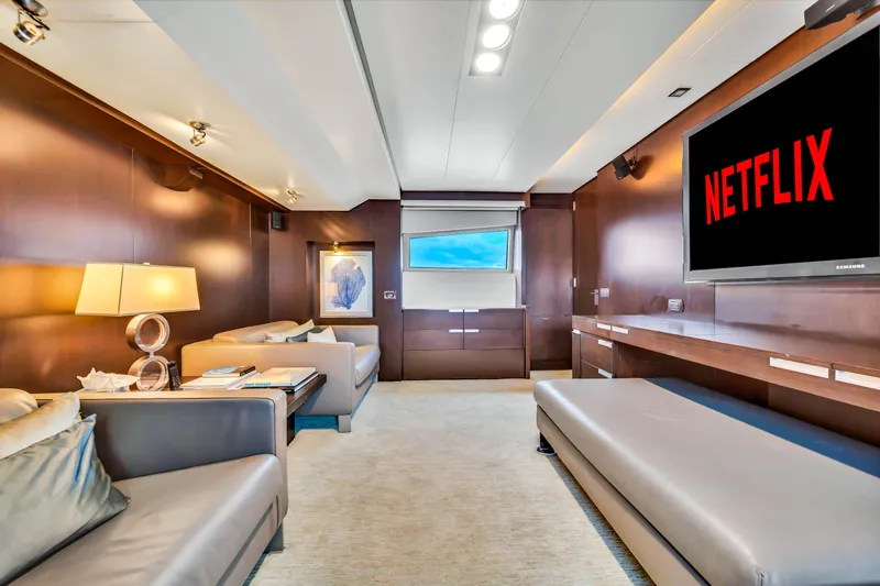  Yacht Photos Pics Luxurious Azimut 116 yacht interior with modern seating and large TV displaying Netflix.