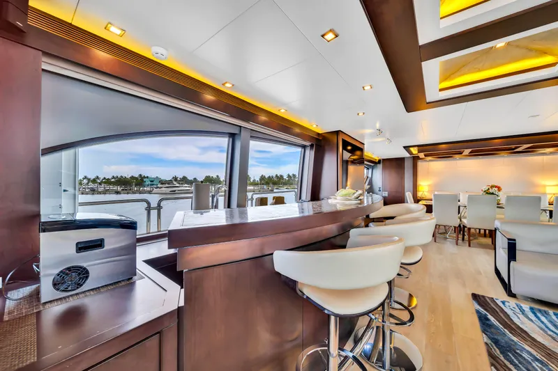  Yacht Photos Pics Luxurious interior of 2012 Azimut 116 yacht with modern bar and seating area.