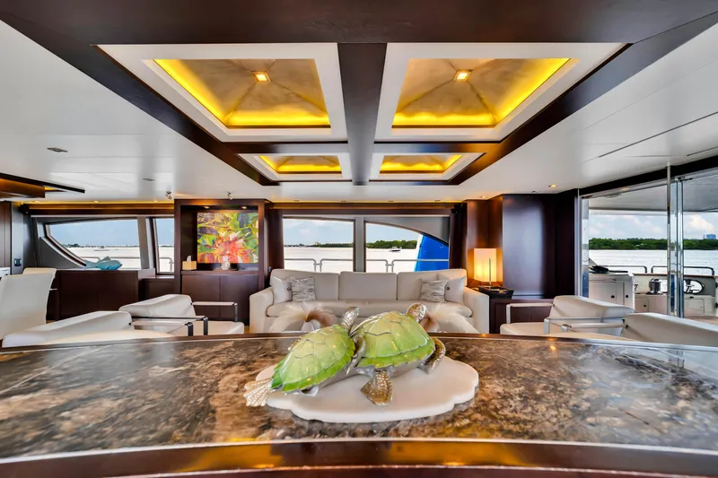  Yacht Photos Pics Luxurious interior of 2012 Azimut 116 yacht with elegant decor and turtle sculpture.
