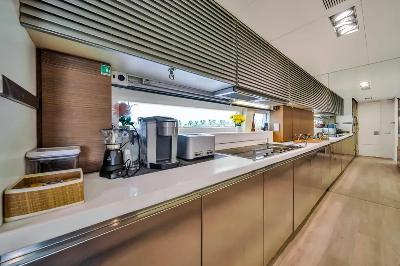  Yacht Photos Pics Modern kitchen interior on 2012 Azimut 116 yacht, featuring sleek countertops and appliances.