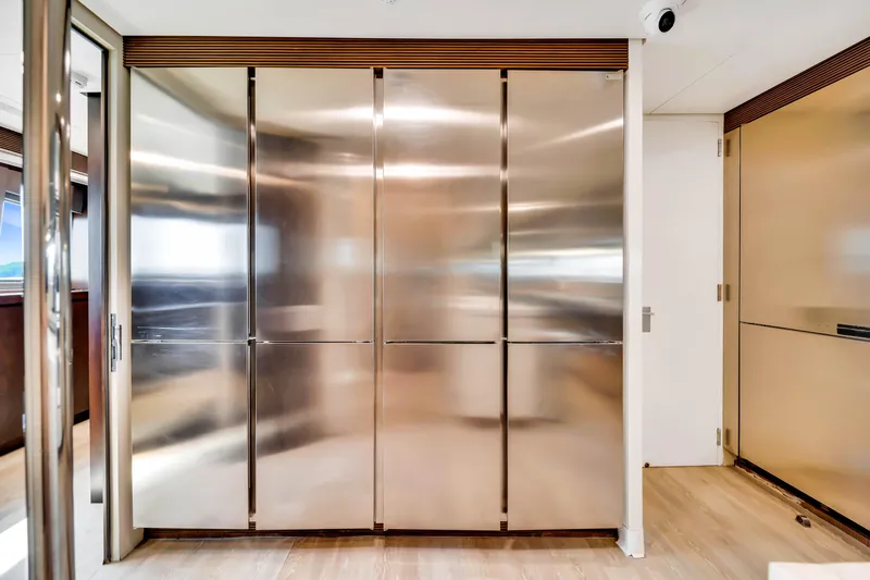  Yacht Photos Pics Luxurious stainless steel kitchen cabinets on a 2012 Azimut 116 yacht interior.